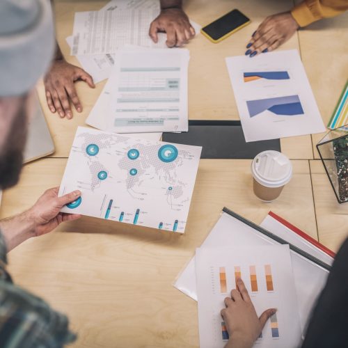 Working on a project. Close up picture of project papers on the table
